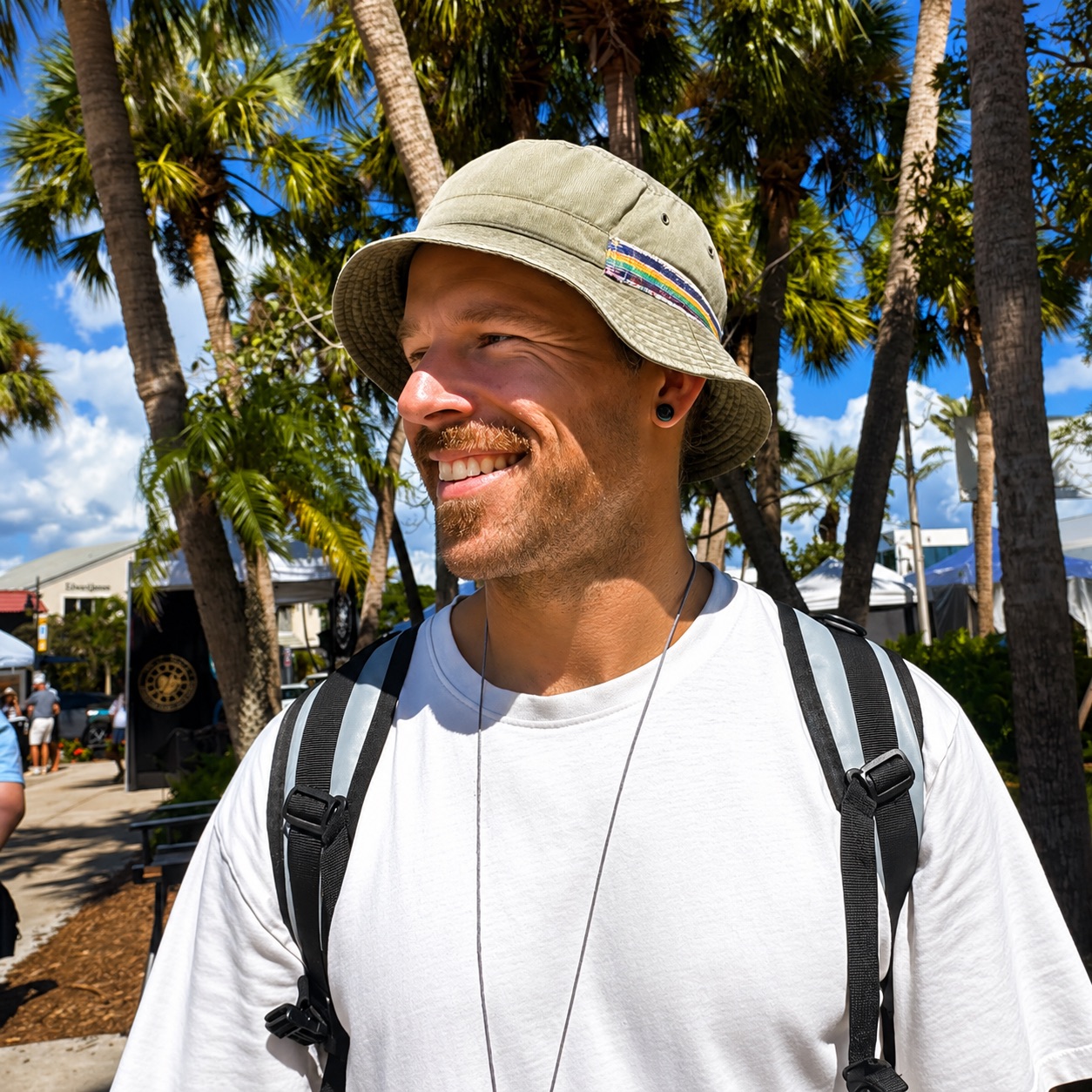 Nick Puetz outdoors beneath palm trees